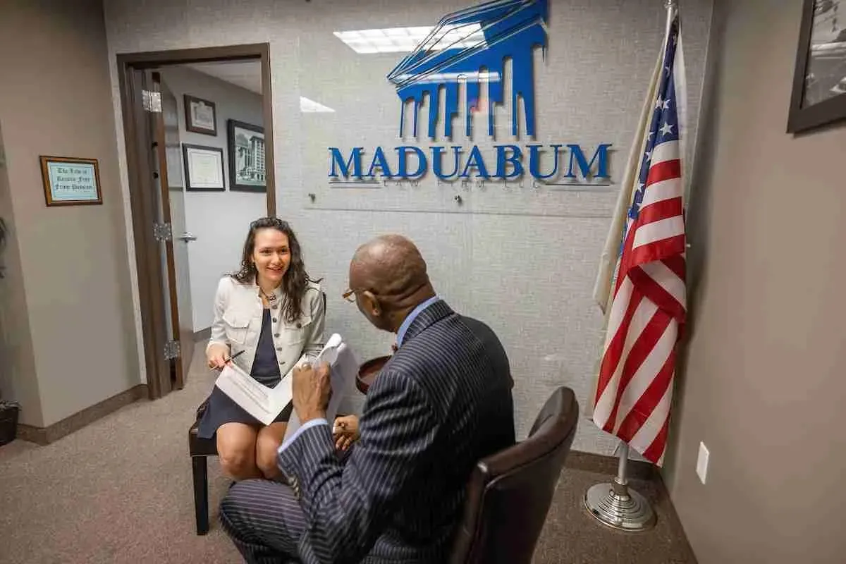 Bankruptcy trustee explaining case details to a client in an office